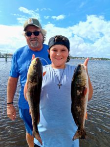 Boy caught two redfish in Flagler Beach, FL